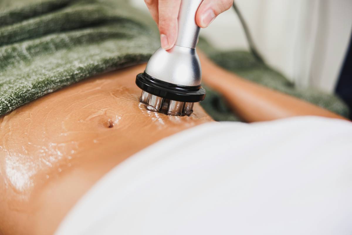 Woman using fat reduction tool contouring how to on thighs with proper gentle pressure